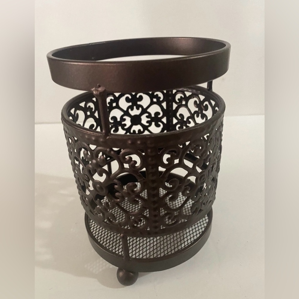 Ornate Brown Metal bronze tone Candle Holder Intricate cut out design 3 footed